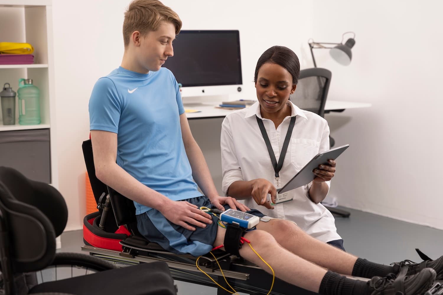 Clinician guiding a patient through a neuromodulation rehabilitation session